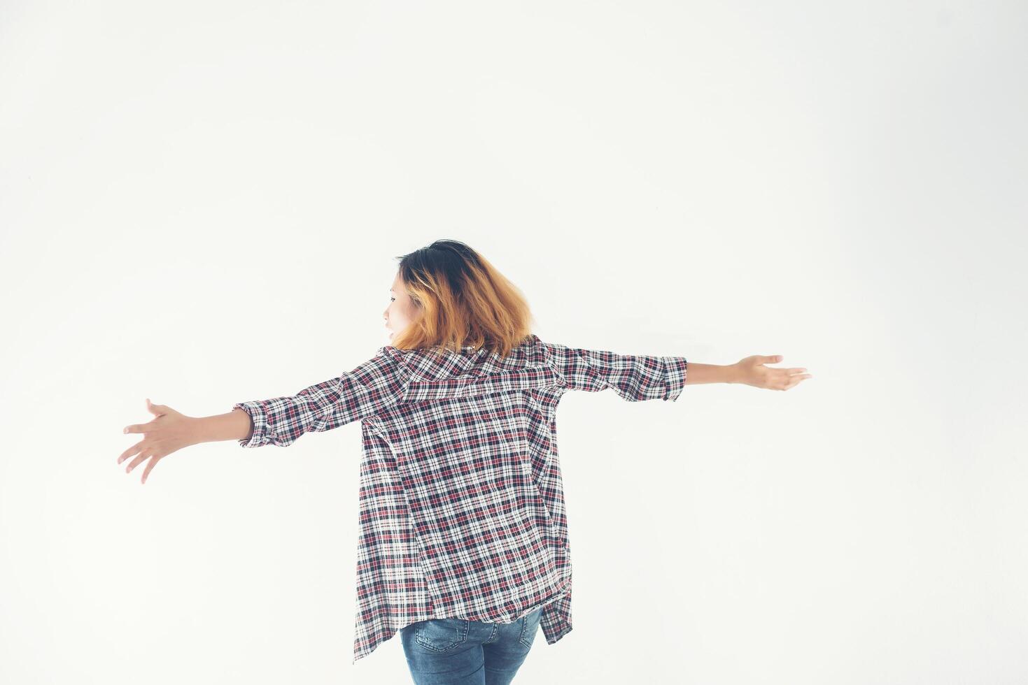 Freedom young hipster woman raising hands with isolated over. photo