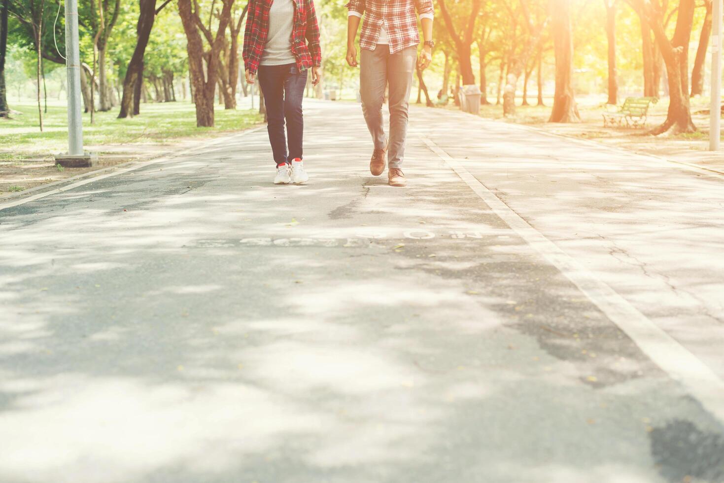 Young teenagers couple walking together in park, Relaxing holiday. photo