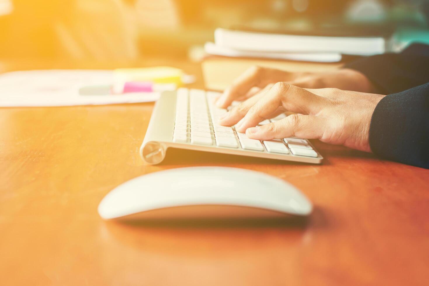 Hands of an office woman typing and work. photo