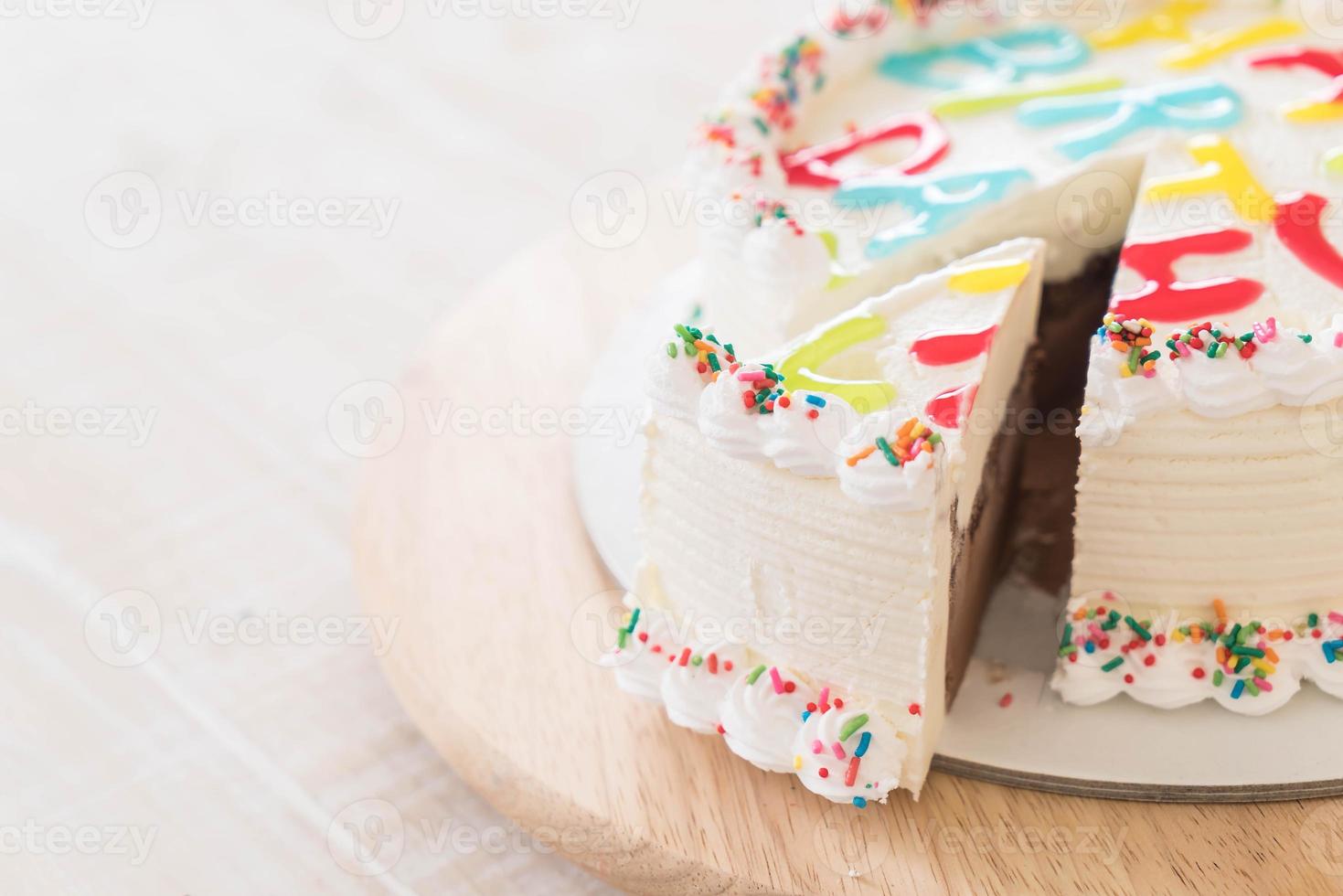 Happy birthday ice-cream cake on table photo