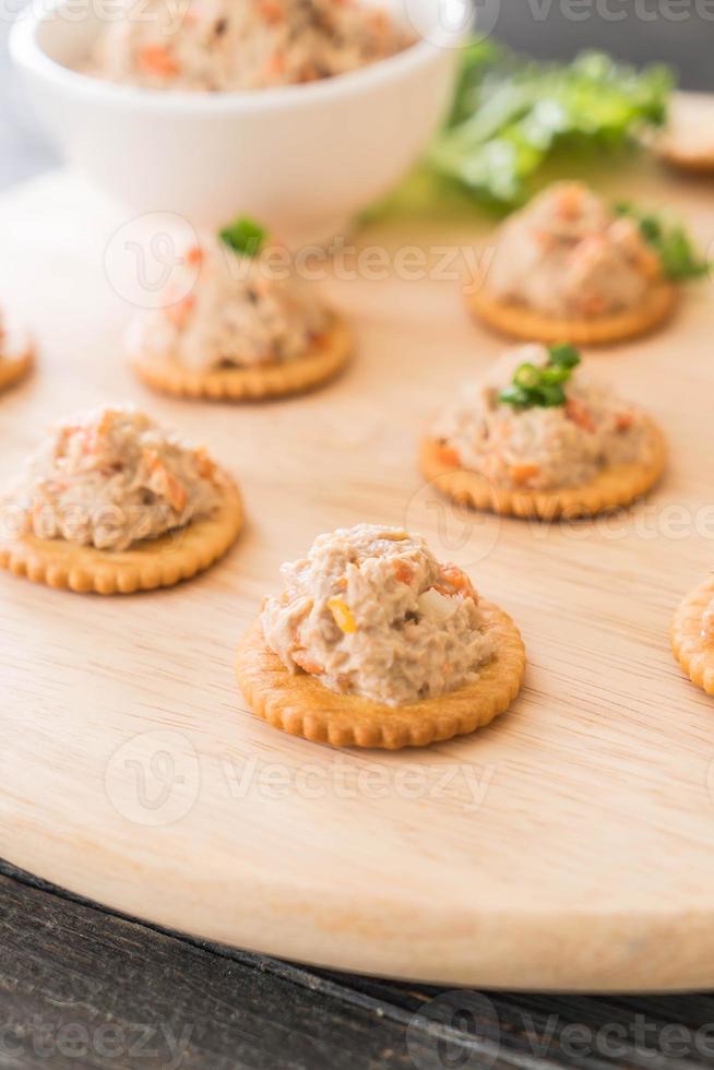 Tuna spread with cracker on wood board 3147693 Stock Photo at Vecteezy