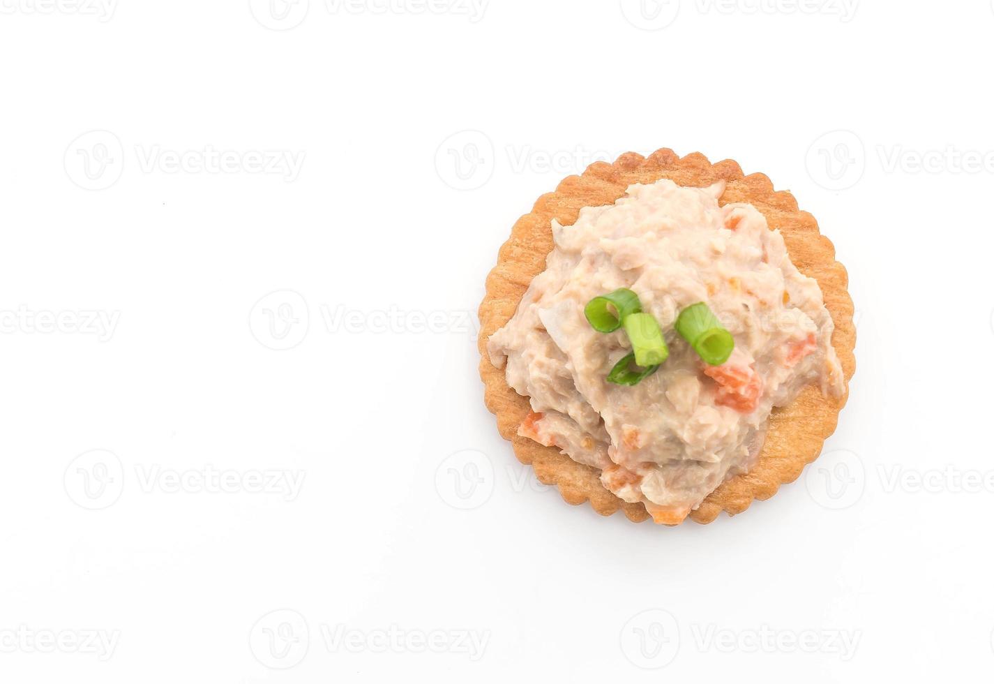 Tuna salad with cracker on white background photo