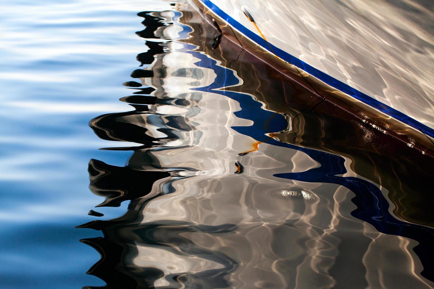 Boat Reflection on the Sea Water photo