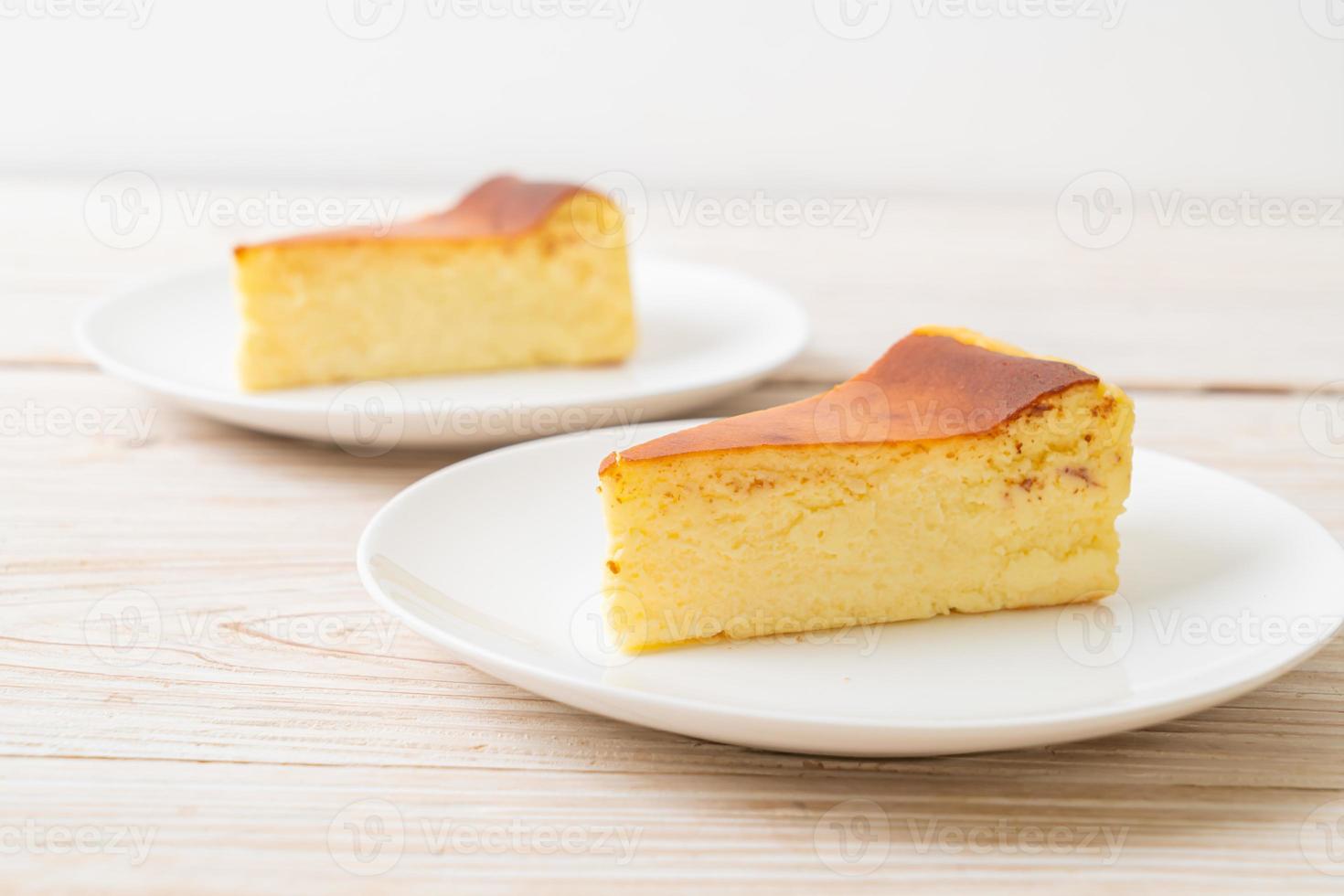 Homemade burn cheesecake on white plate photo