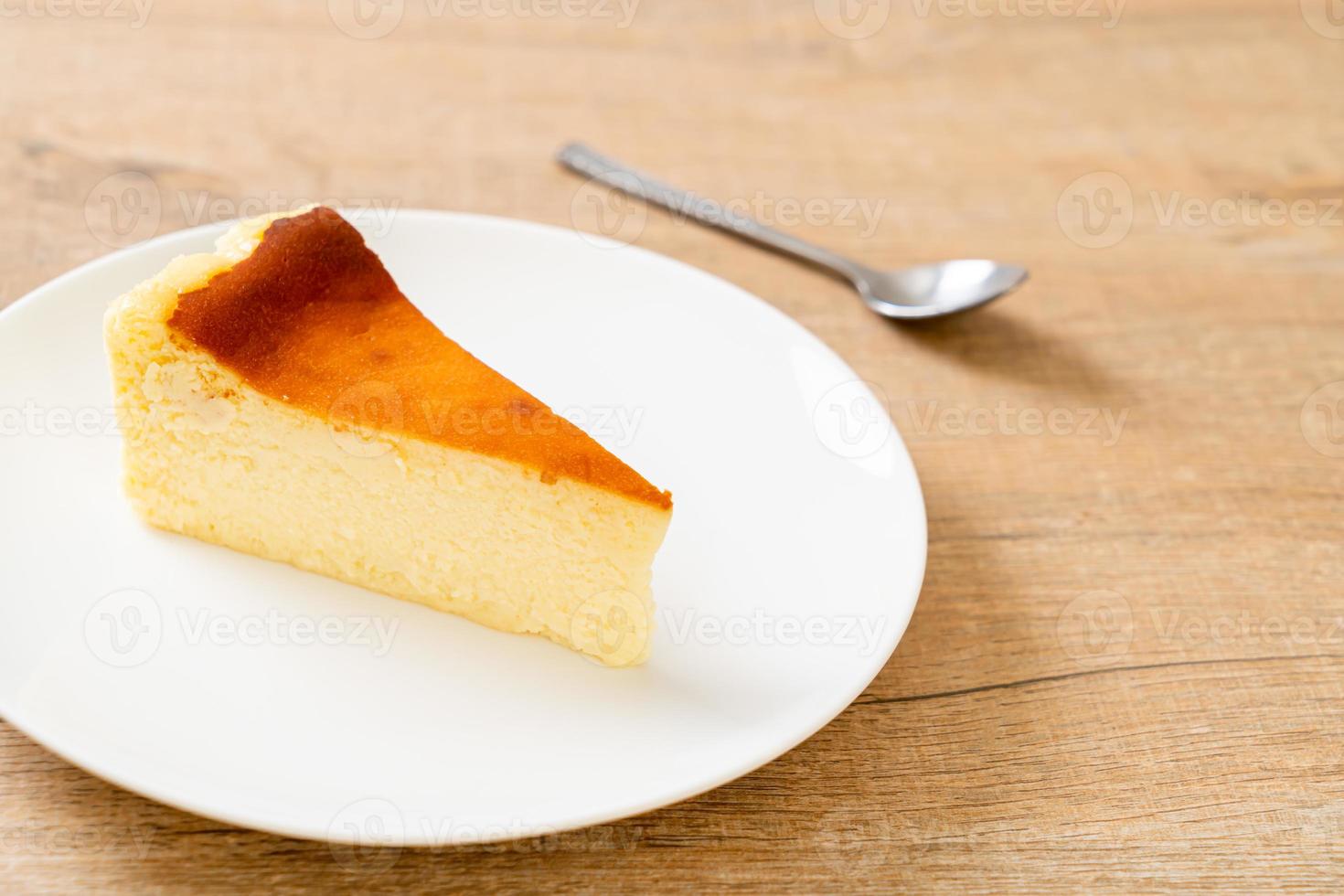 Homemade burn cheesecake on white plate photo