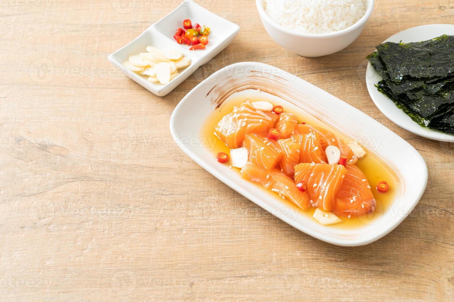 Fresh salmon raw marinated shoyu or salmon pickled soy sauce - Asian food style photo