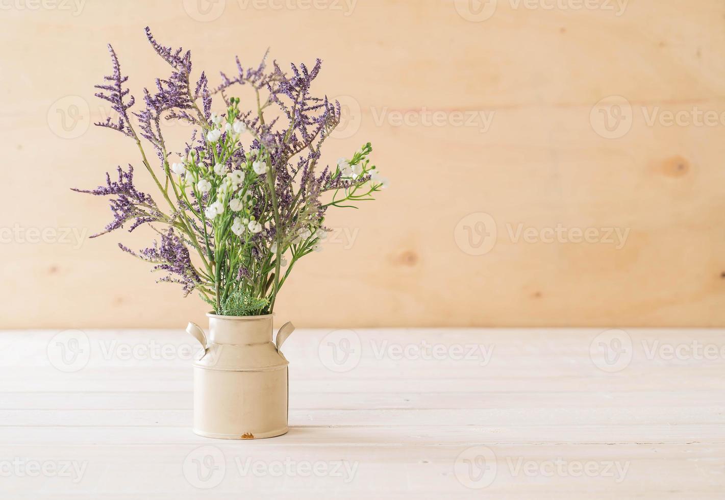 Statice and caspia flowers in vase photo