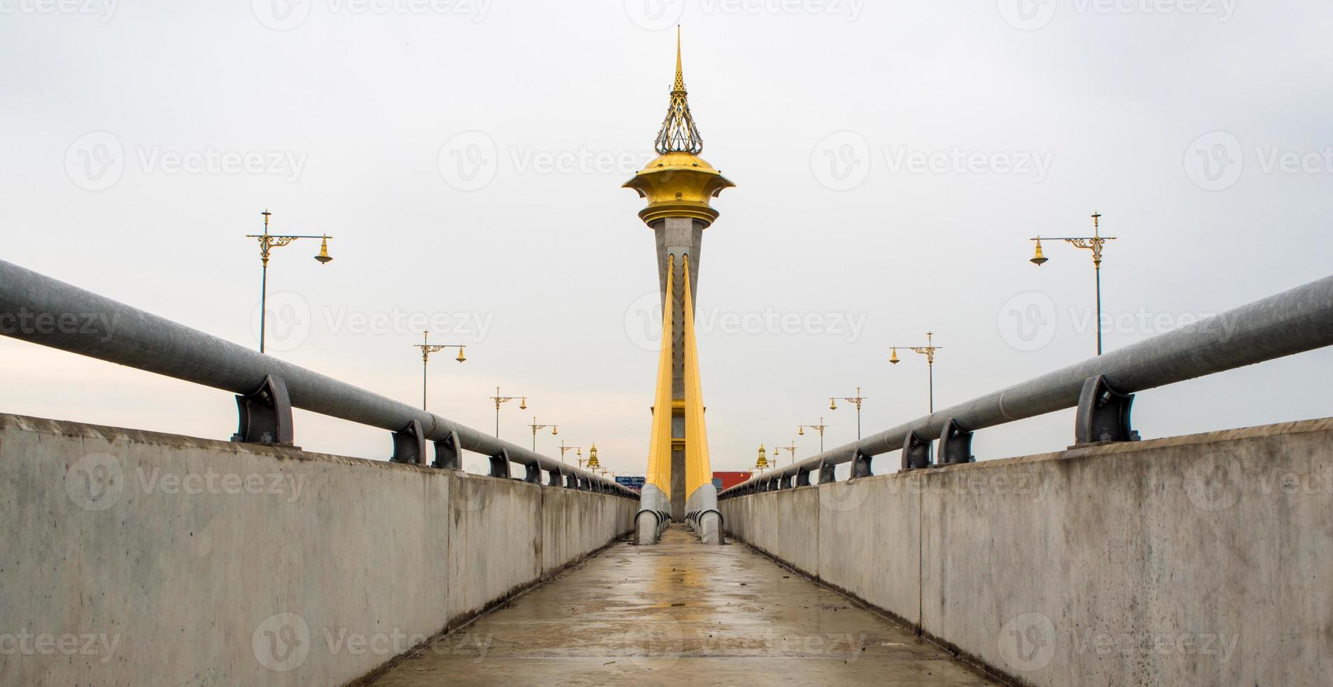 Beautifully decorated structure at the top of the bridge tower photo