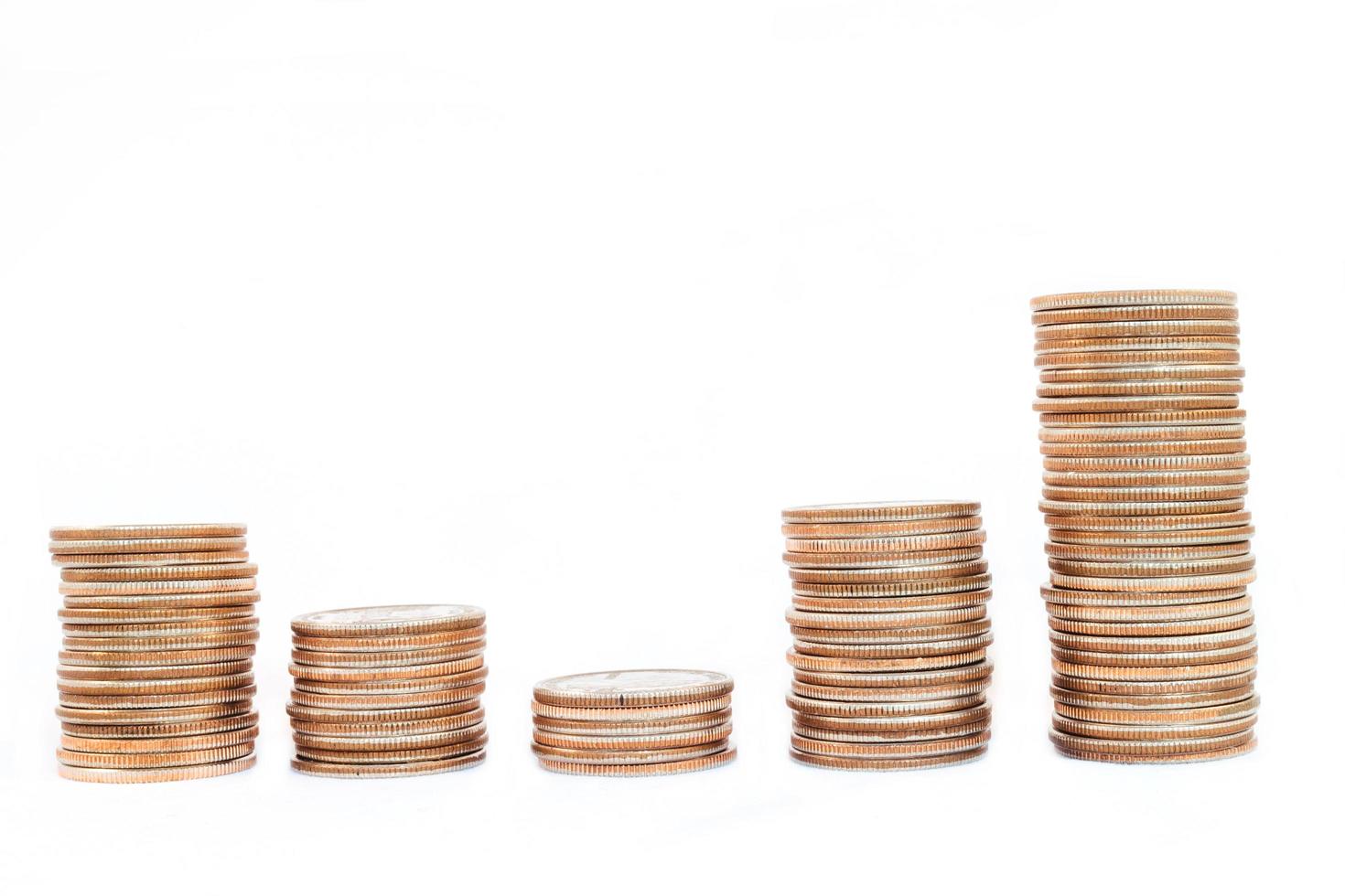 Coin piles on white background. photo