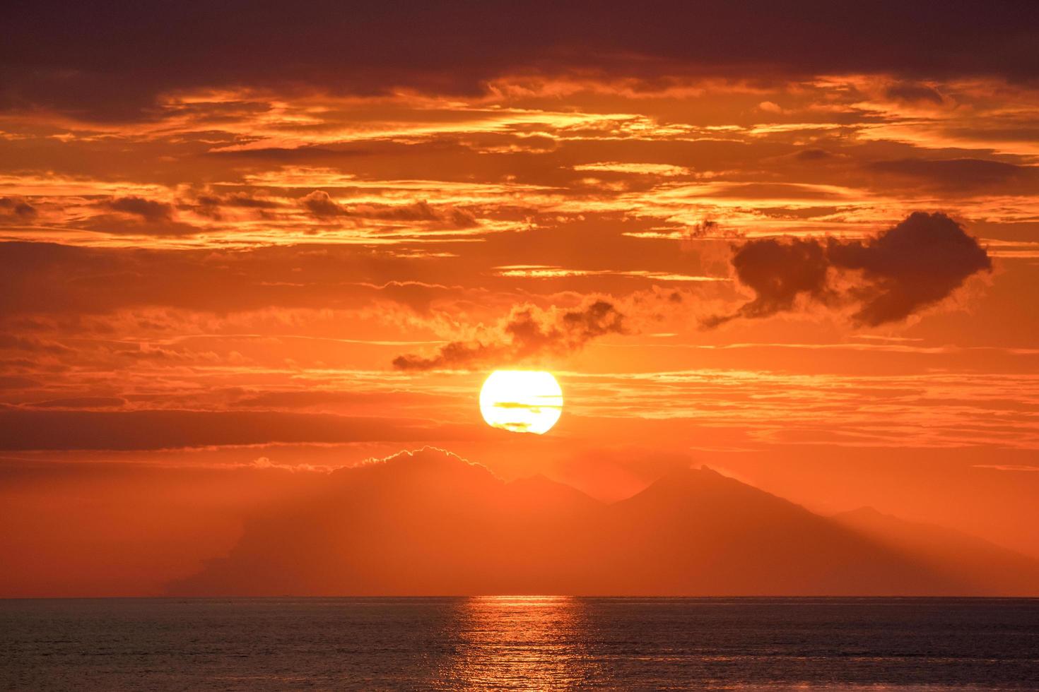 Beautiful golden orange sunset over the ocean. photo