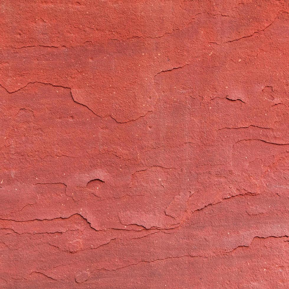 Fondo de textura de piedra rugosa roja. foto