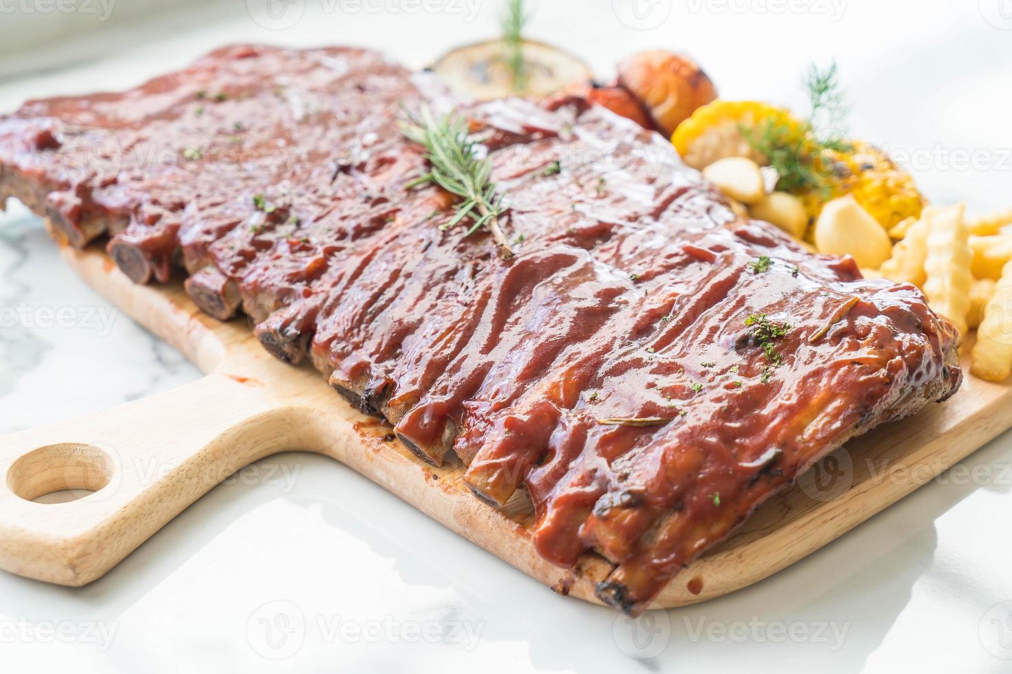 Grilled rib pork with barbecue sauce and vegetable photo