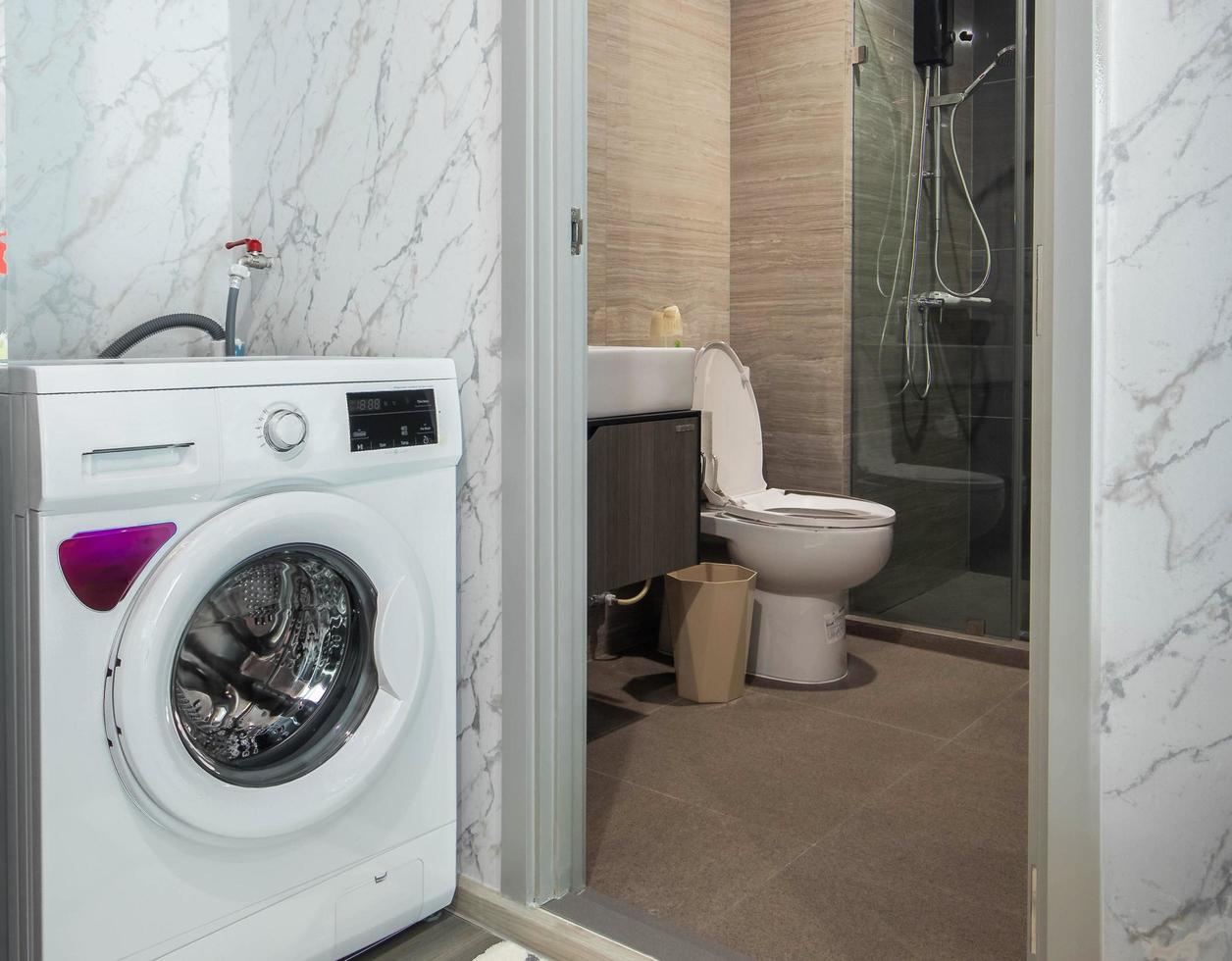 Small white bathroom in apartment photo