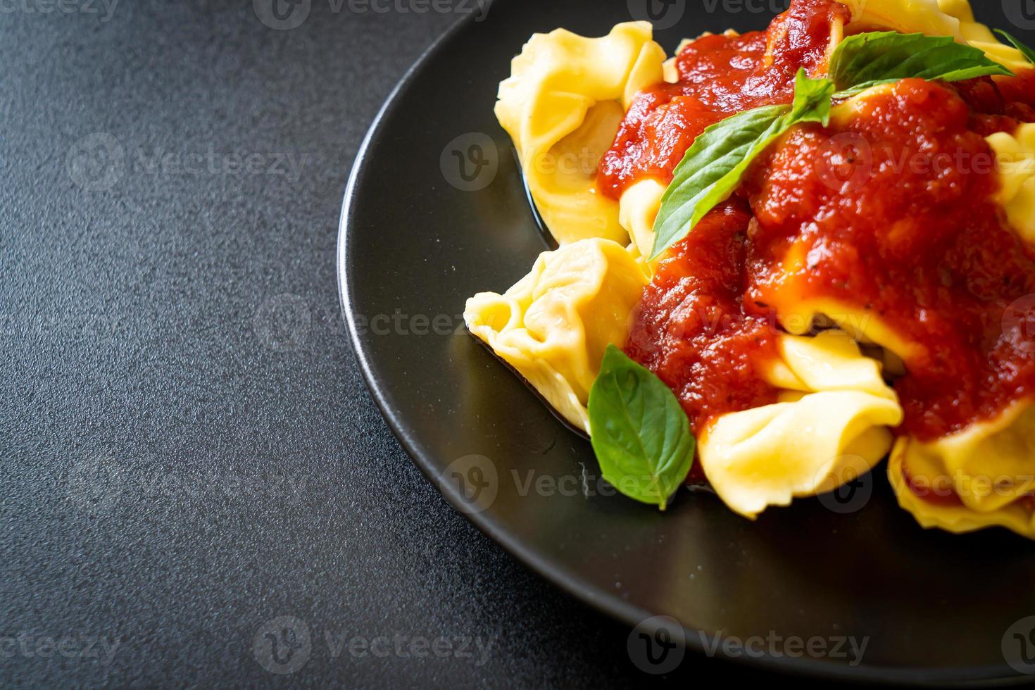 Italian tortellini pasta with tomato sauce photo