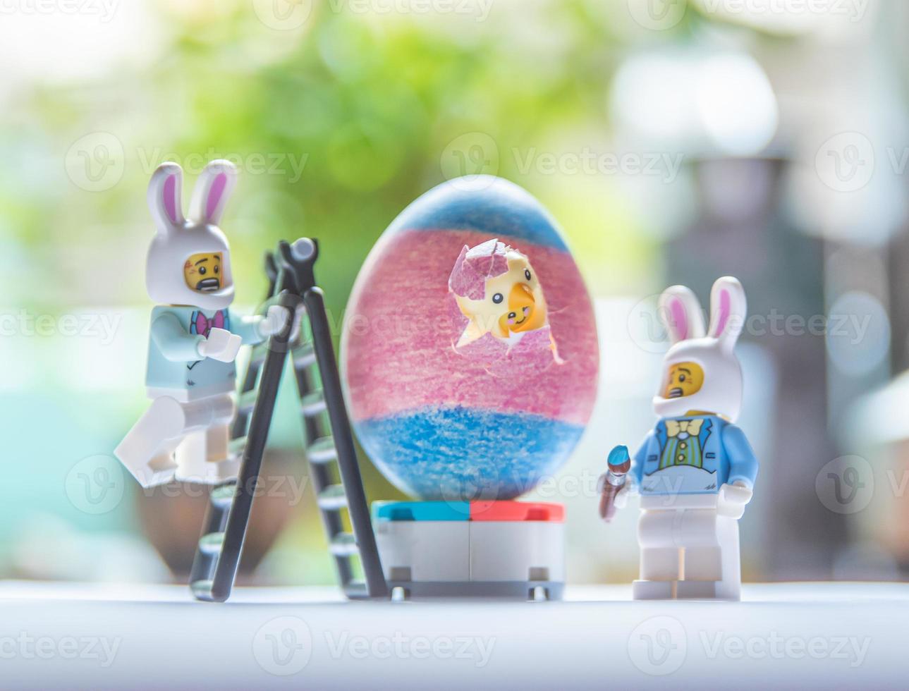 Warsaw - May 2020 - lego minifigure during painting of easter egg photo