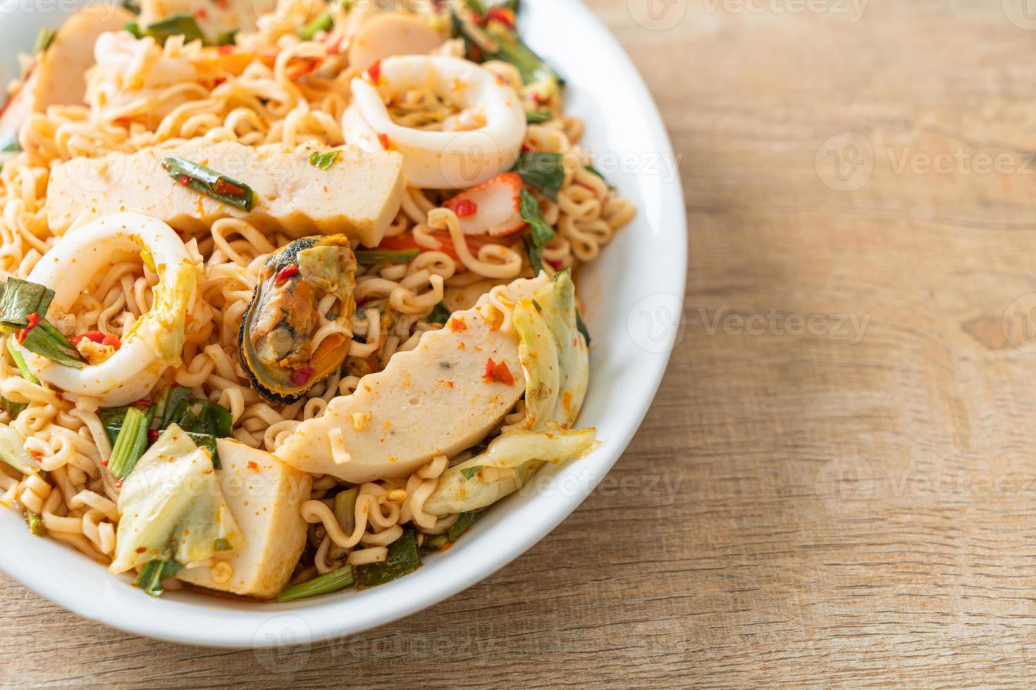 Instant noodle spicy salad with mixed meats photo