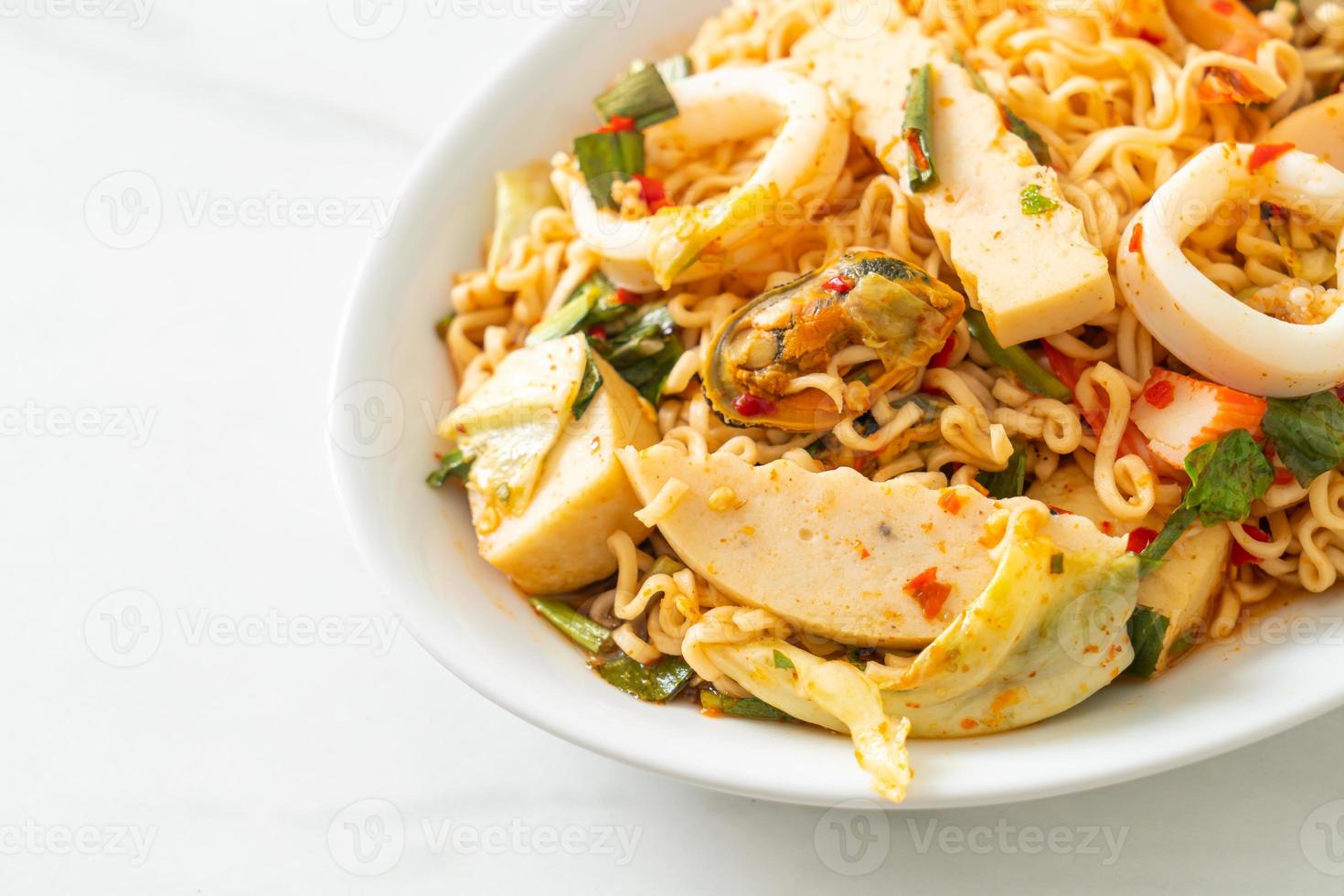 Instant noodle spicy salad with mixed meats photo