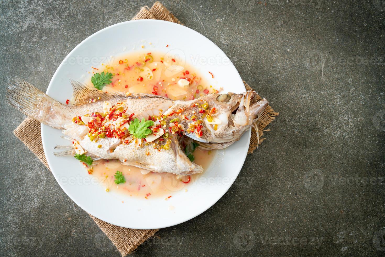 Steamed grouper fish with lime and chillies photo