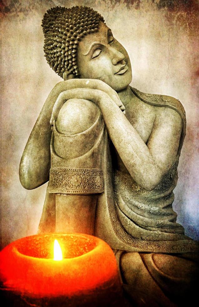 Retro Grunge Buddha Sculpture and Candle Light photo