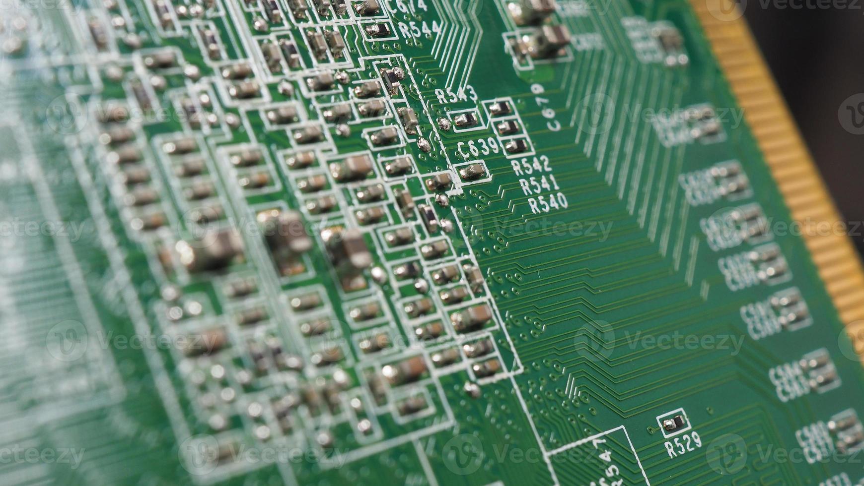 Semiconductor chip located on the green motherboard photo