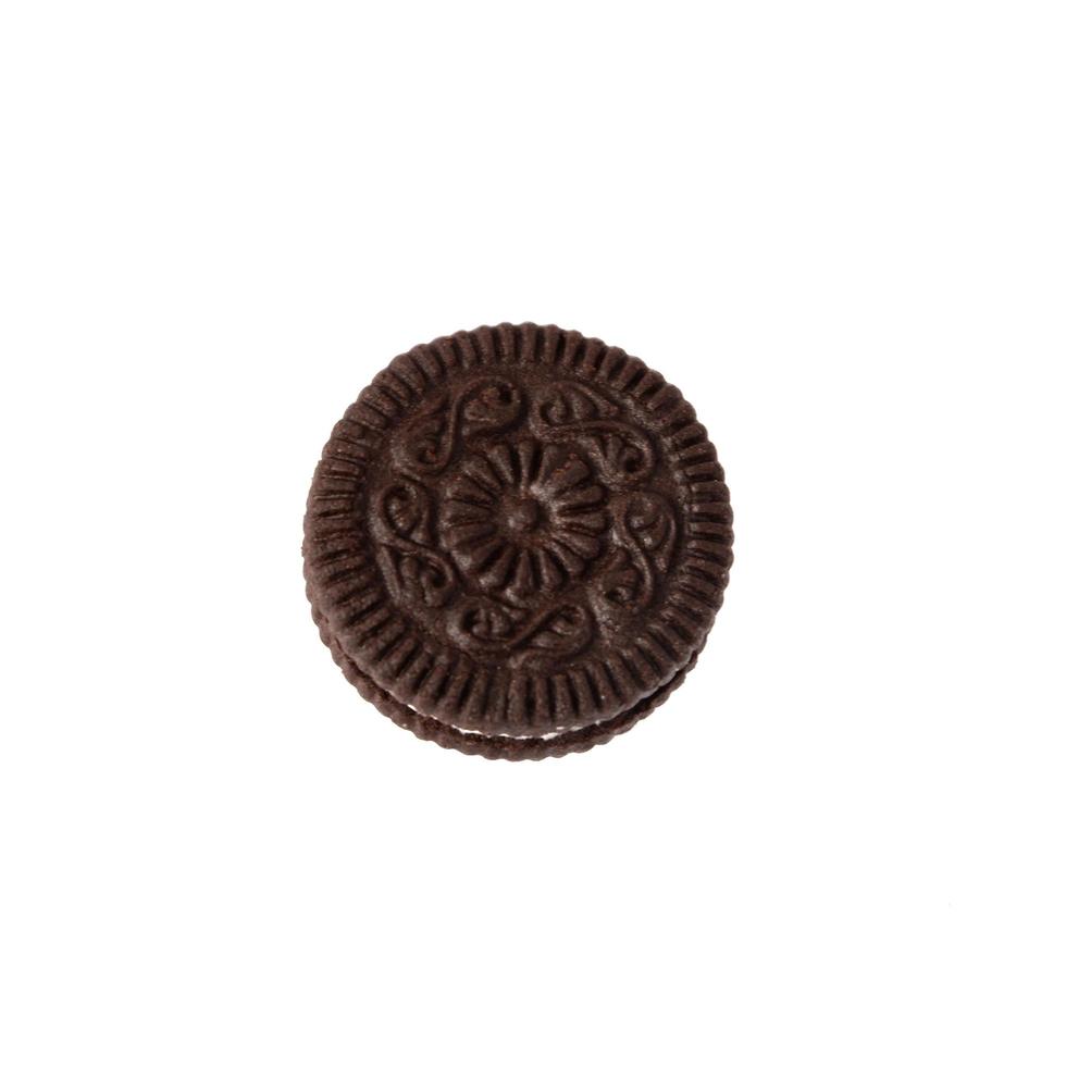 Tasty chocolate cookies with cream on white background photo