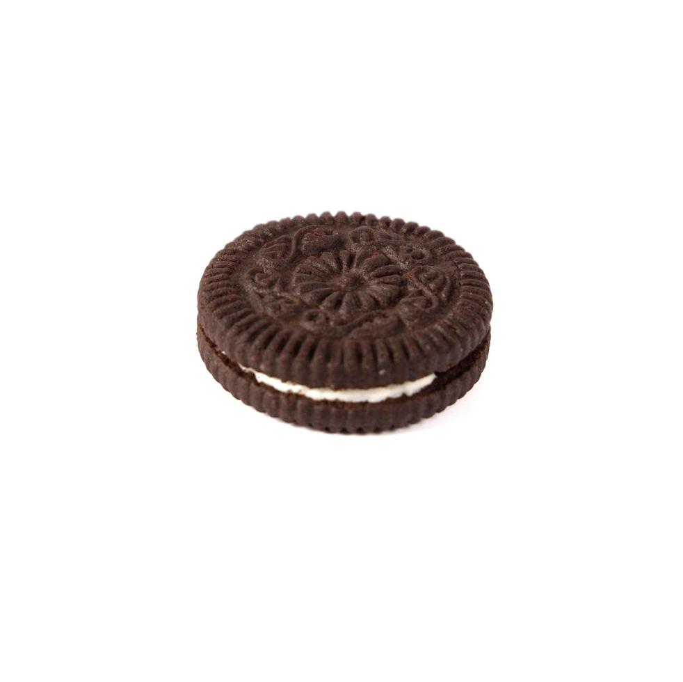 Tasty chocolate cookies with cream on white background photo