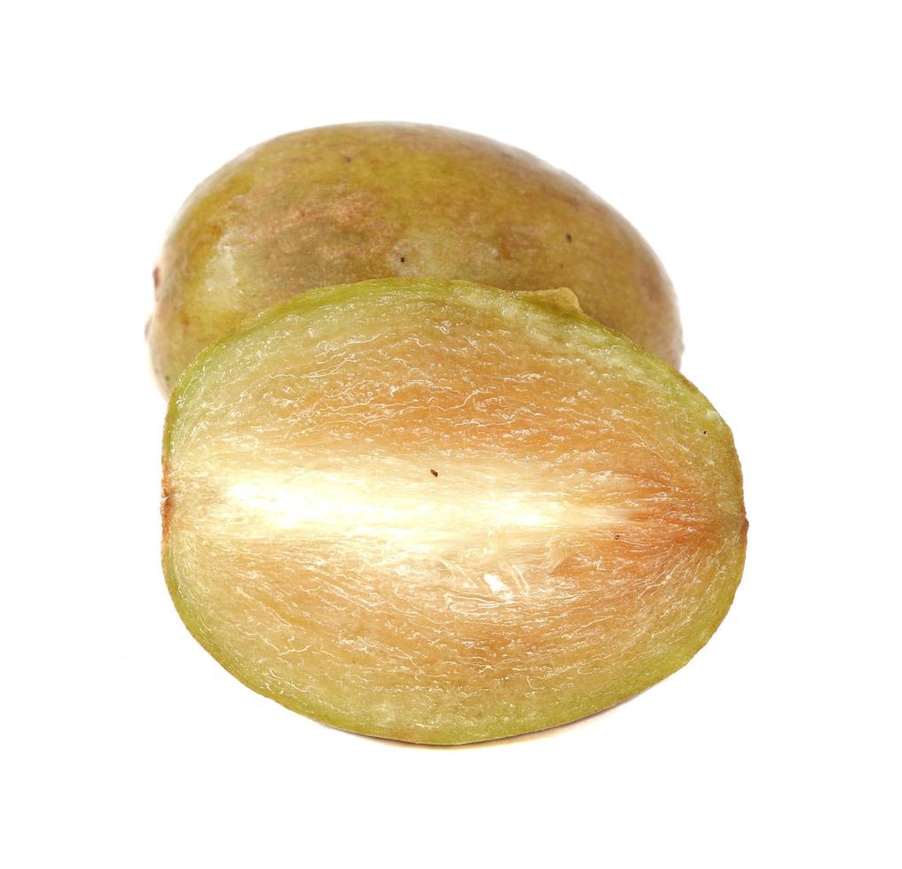 Fresh sapodilla plum with cut on white photo