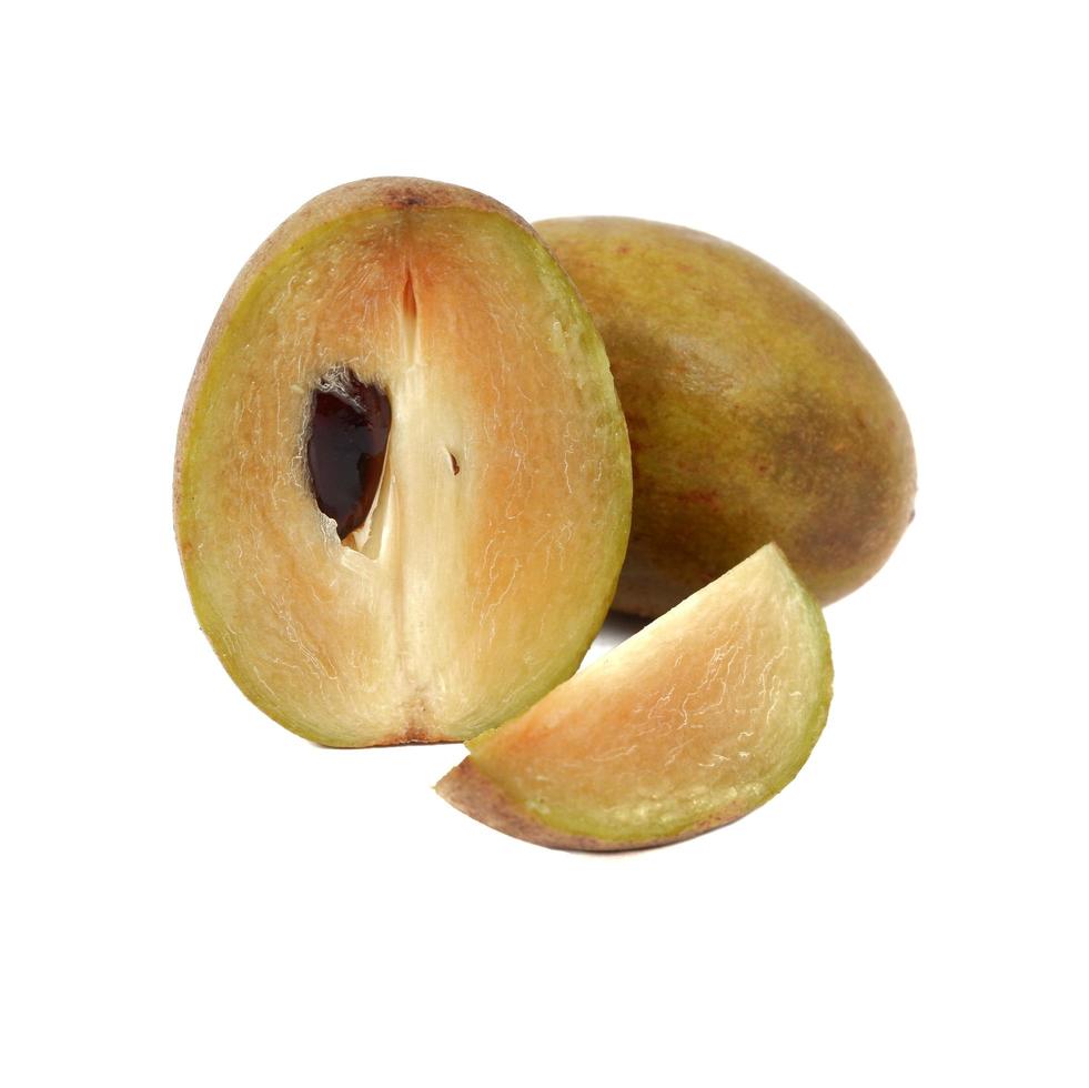 Fresh sapodilla plum with cut on white photo