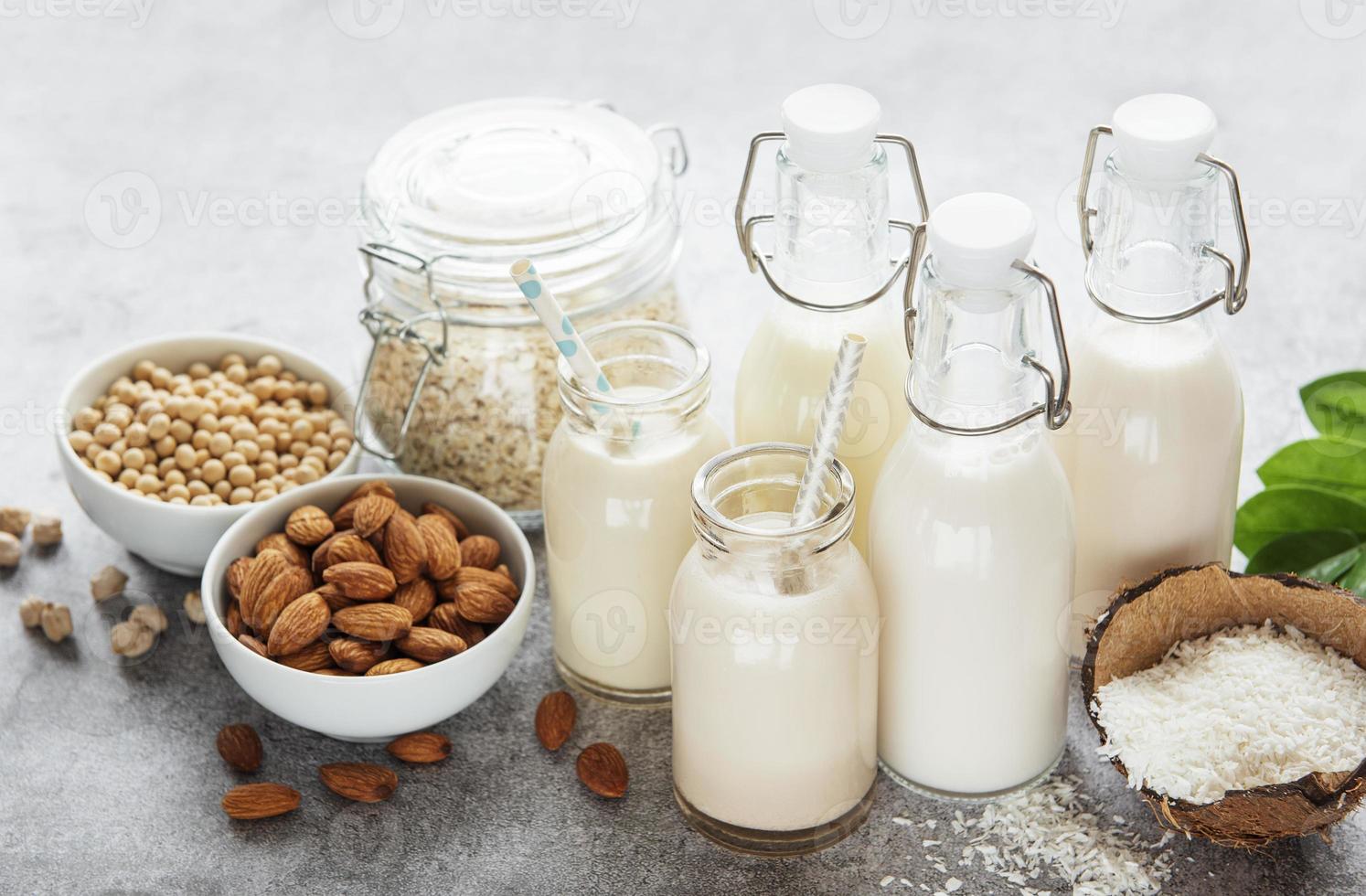 Alternative types of vegan milks in glass bottles photo