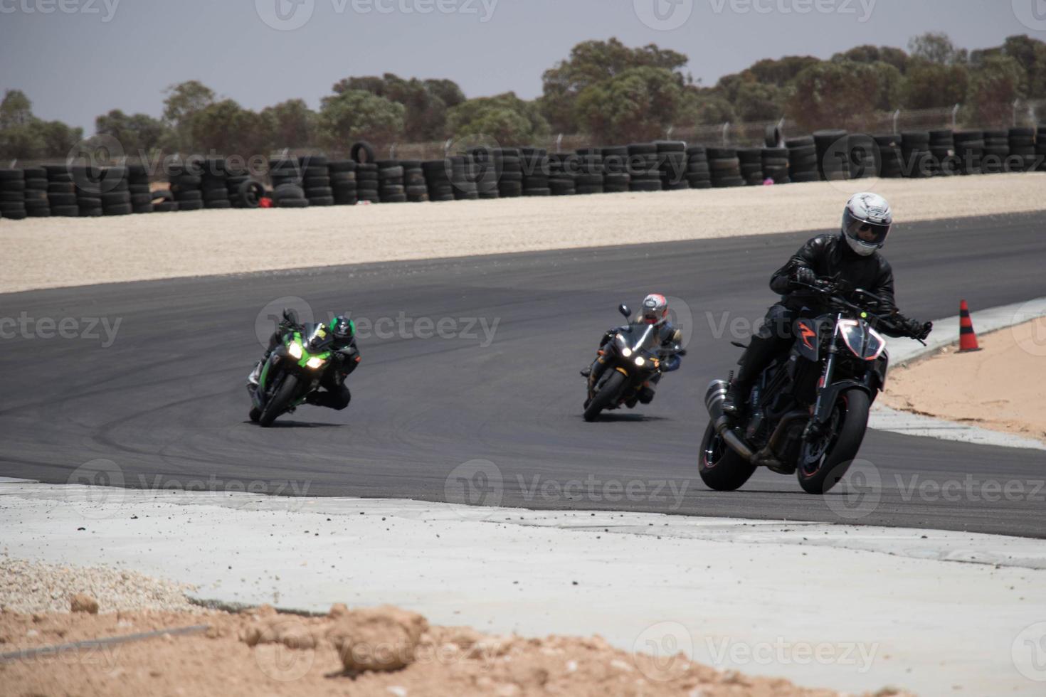 Motorcycle competition at a race track on a training day photo