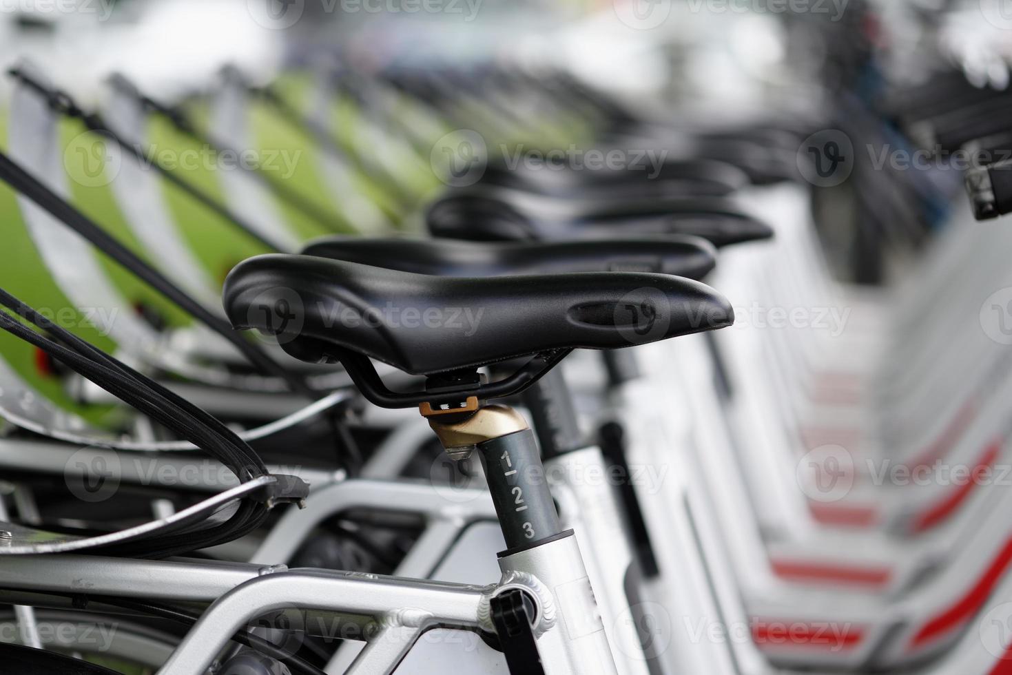 Several rental bikes on a street in cologne photo