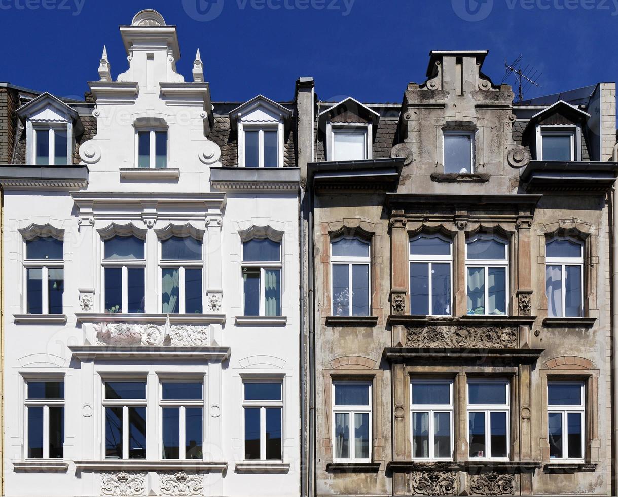 Renovated and not renovated old building twins in cologne photo