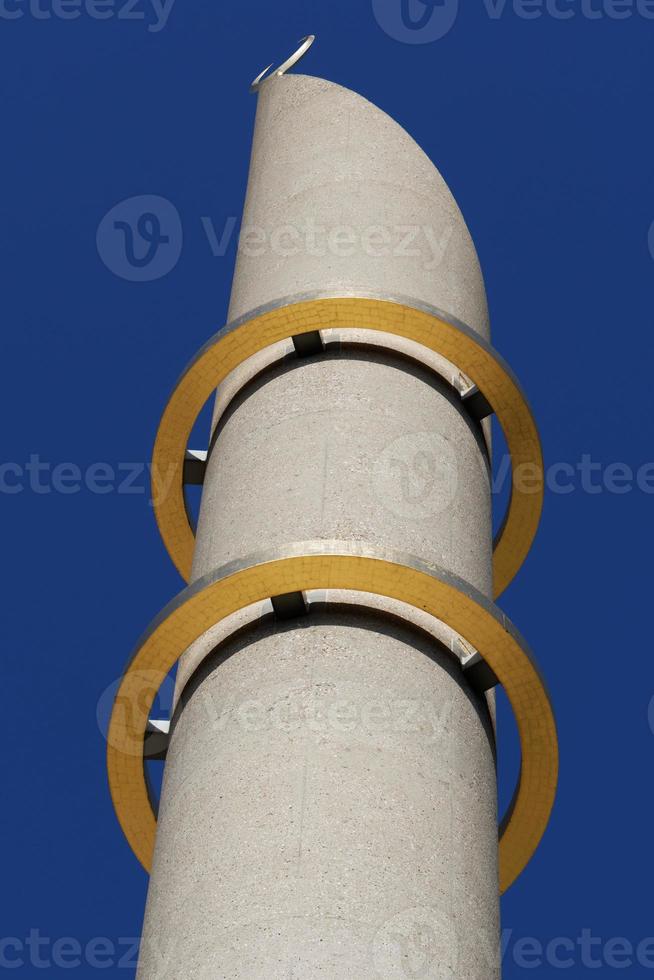 Minaret of the mosque of cologne with the two golden rings photo