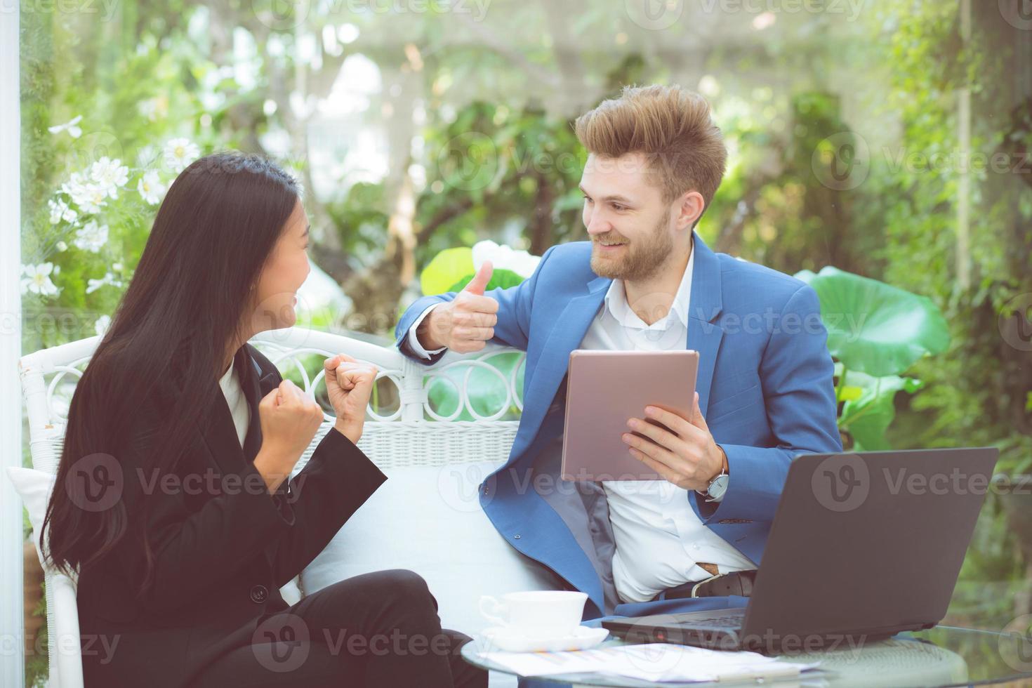 Businesspeople using digital tablet computer working at office photo