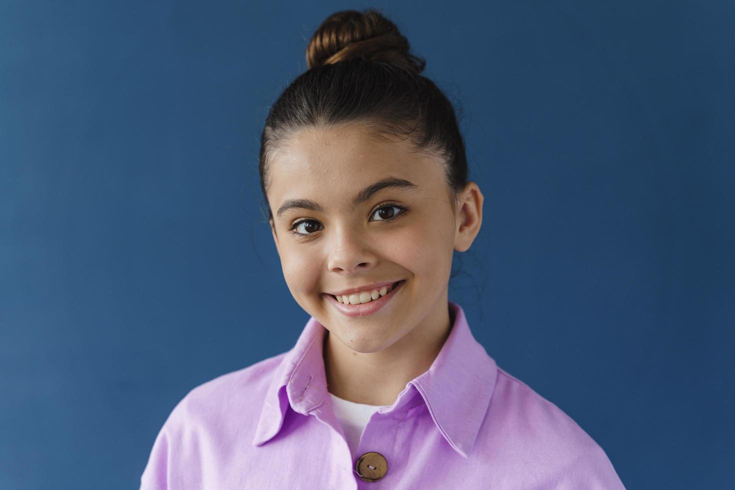 Close-up view, positive teenage girl smiling beautifully photo