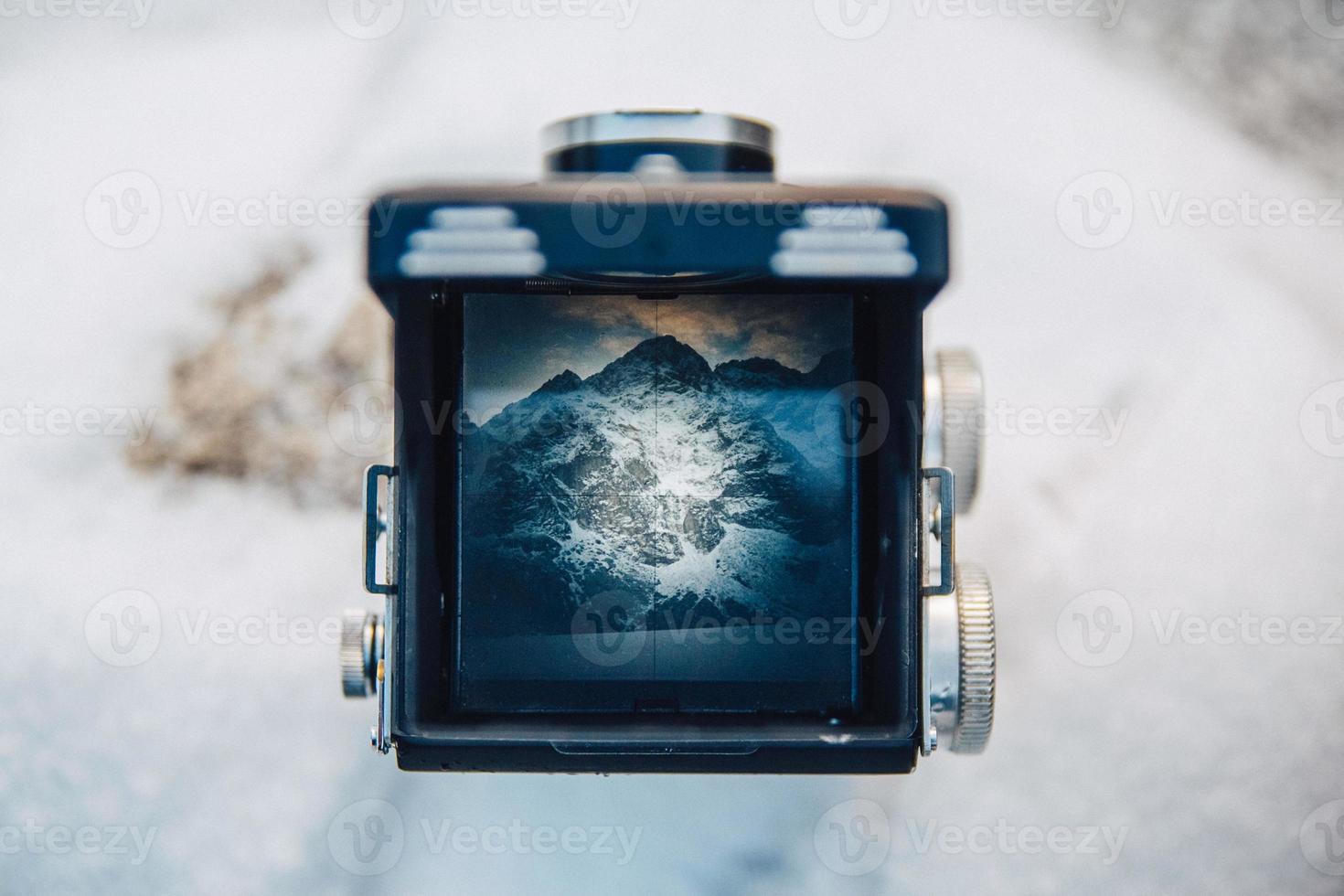 Mountain scenery through the viewfinder of the old camera photo