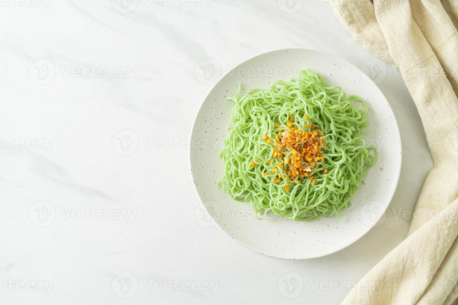 Green jade noodle with garlic on plate photo