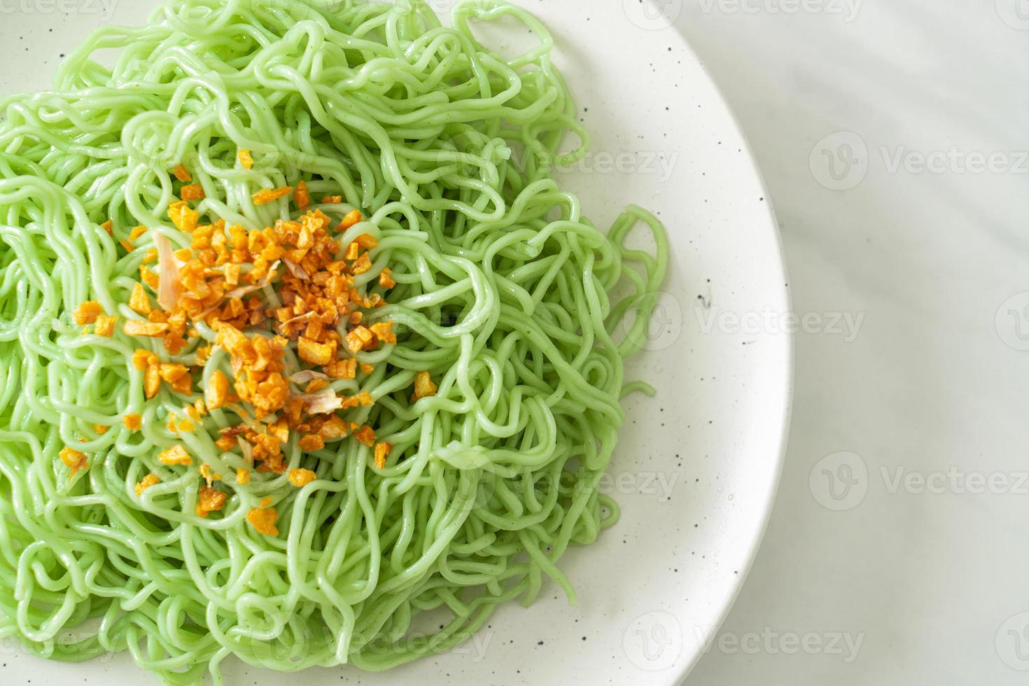 Green jade noodle with garlic on plate photo