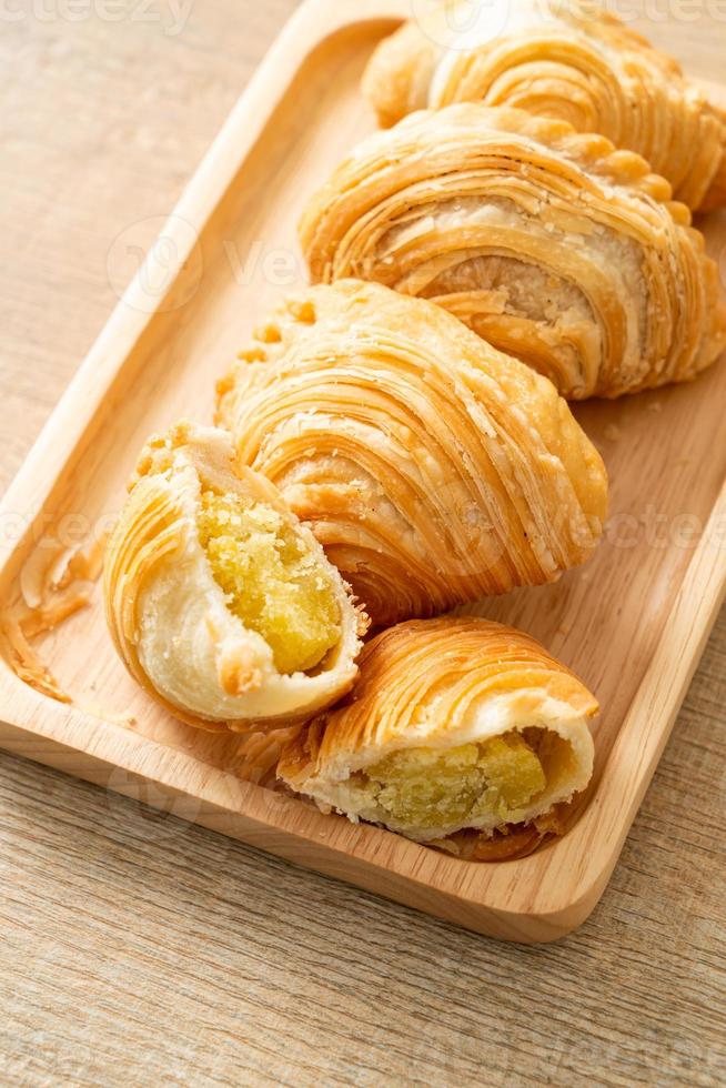 Curry puff pastry stuffed beans on wooden plate photo