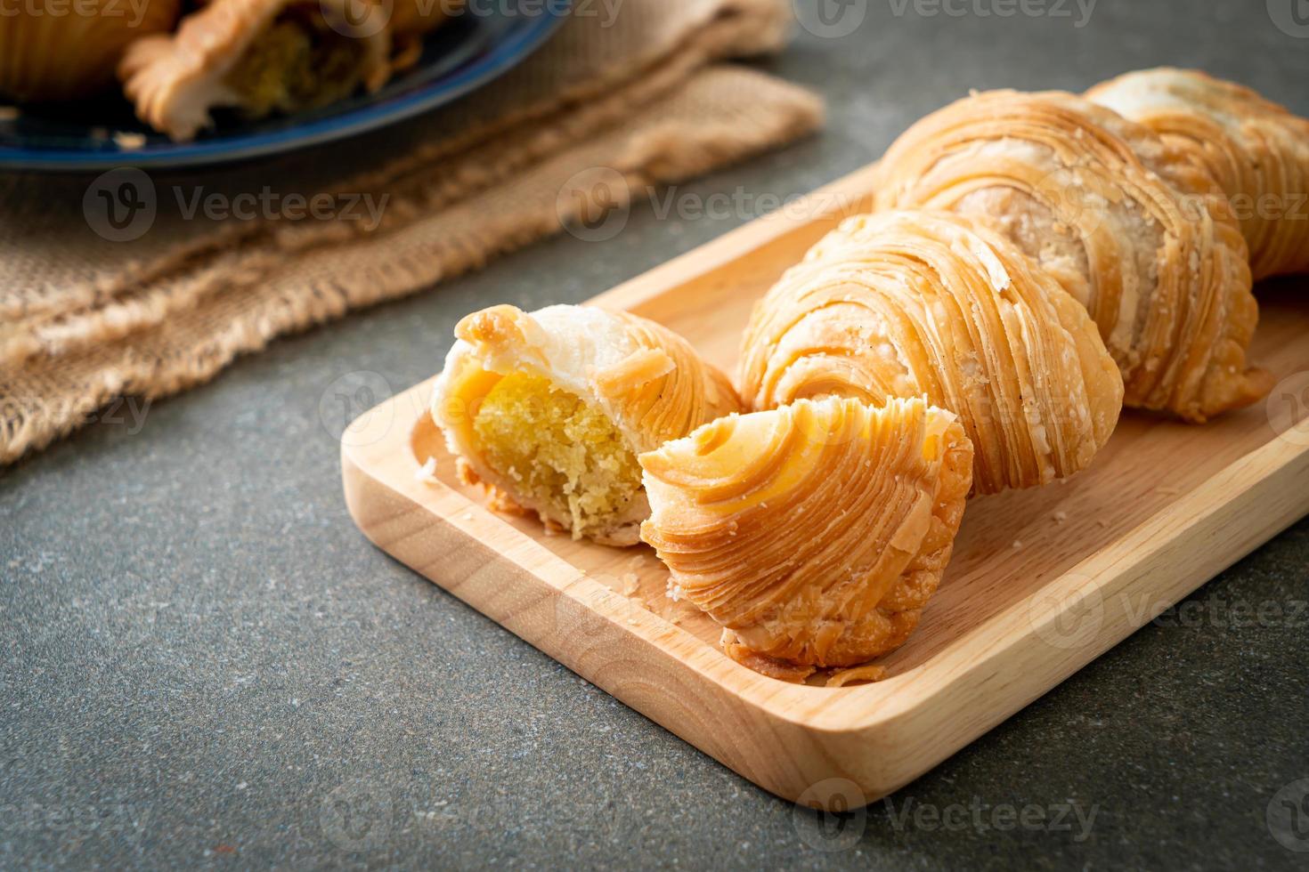 Curry puff pastry stuffed beans on wooden plate photo