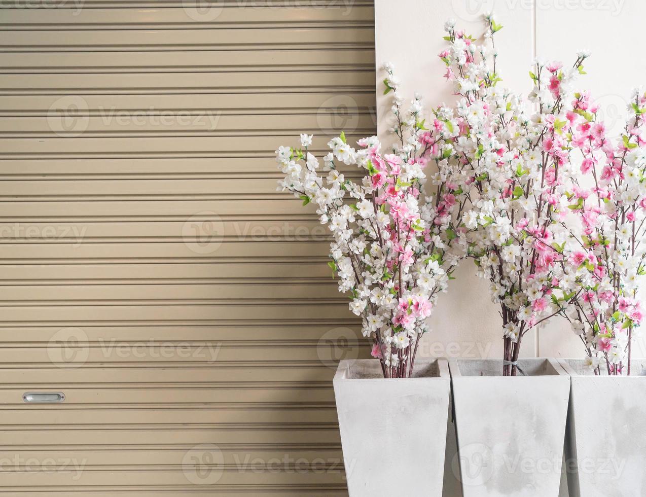 Plastic sakura in vase with copy space photo