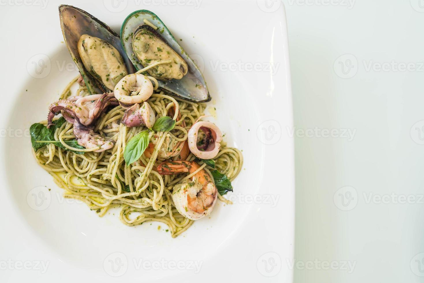 Peasto spicy seafood in white plate photo