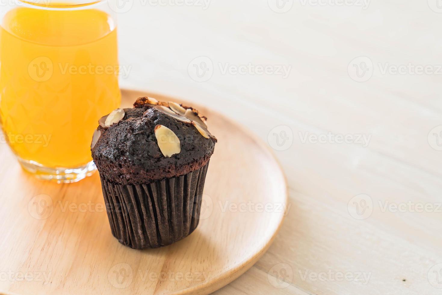 Dark chocolate cup cake with orange juice photo