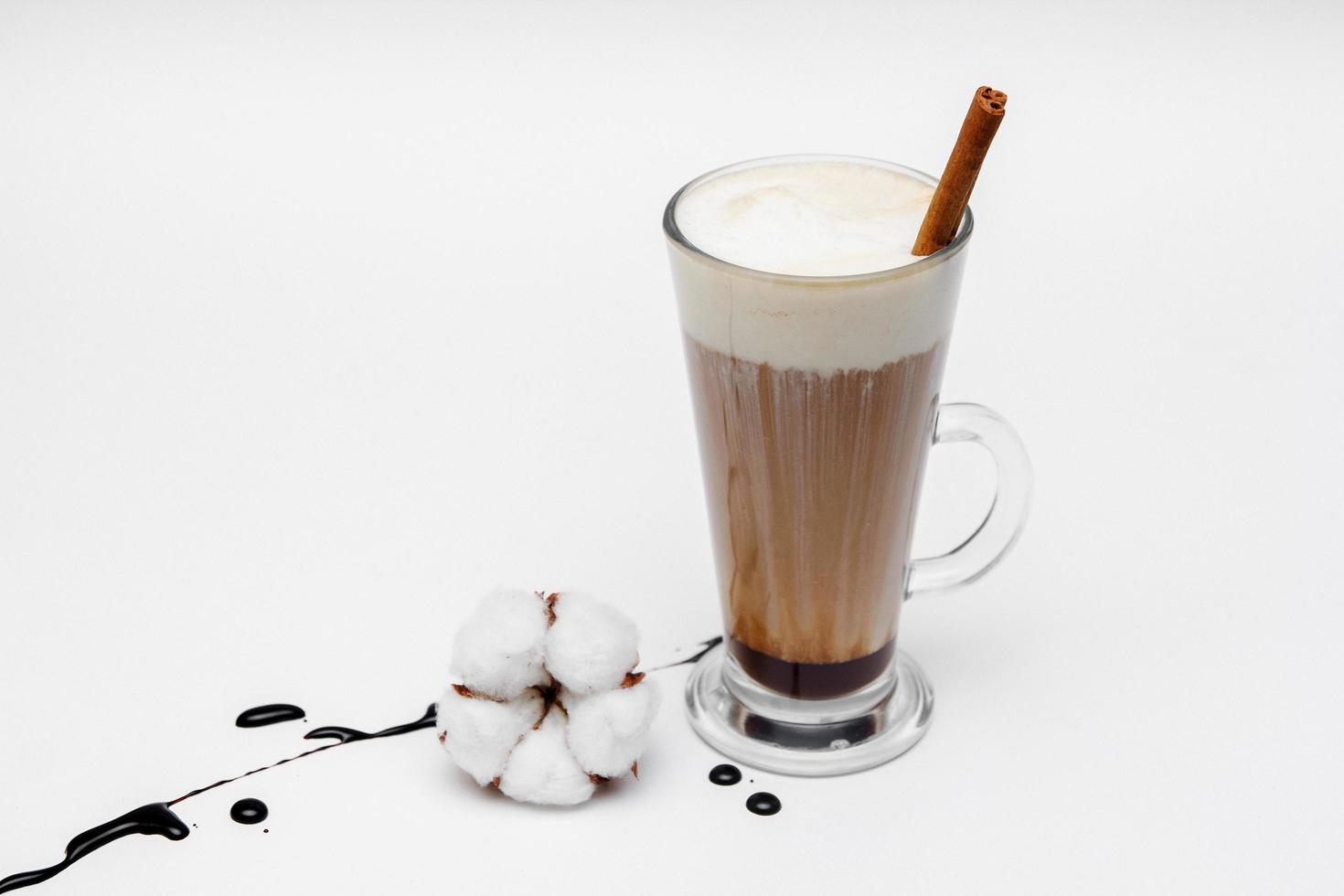Coffee cappuccino with cinnamon and anise stars on white background photo