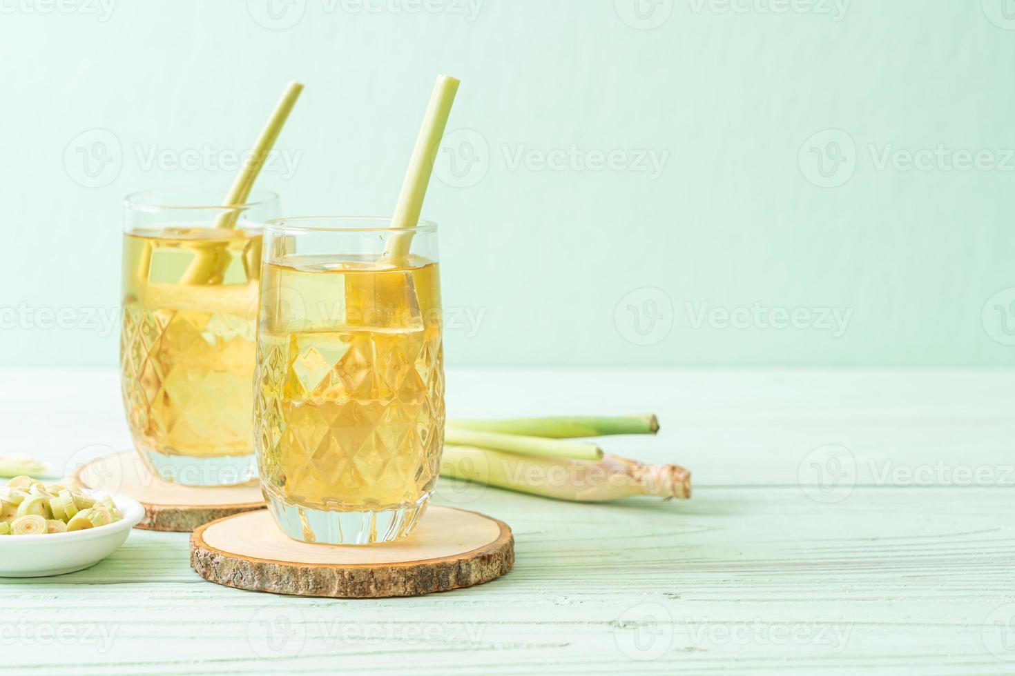 Iced lemon grass juice on wood background photo