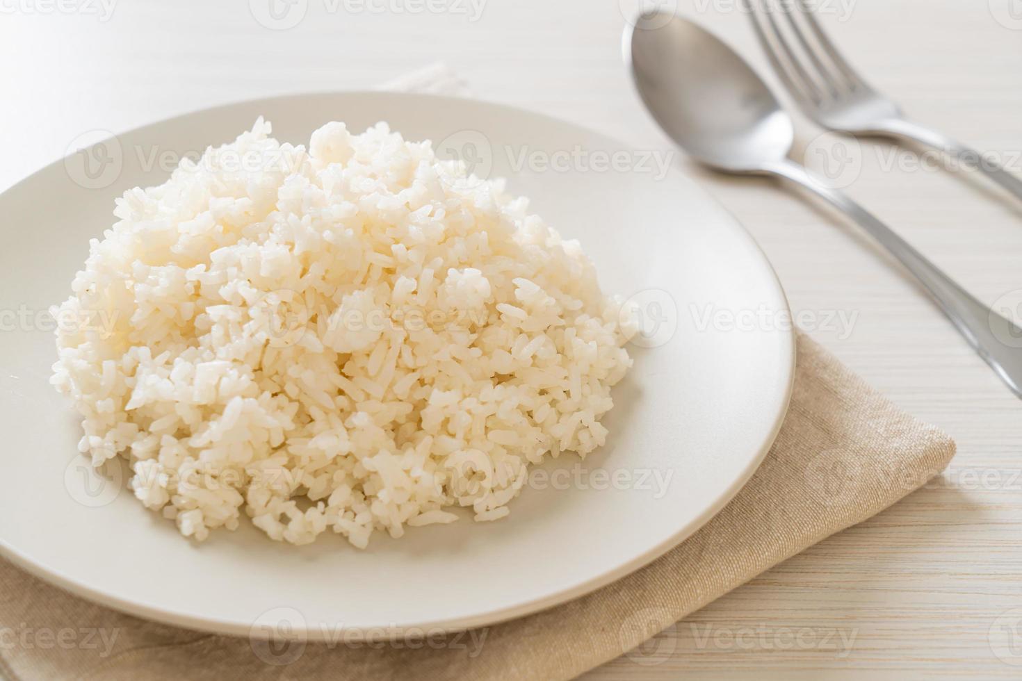 Cooked Thai jasmine white rice on plate photo