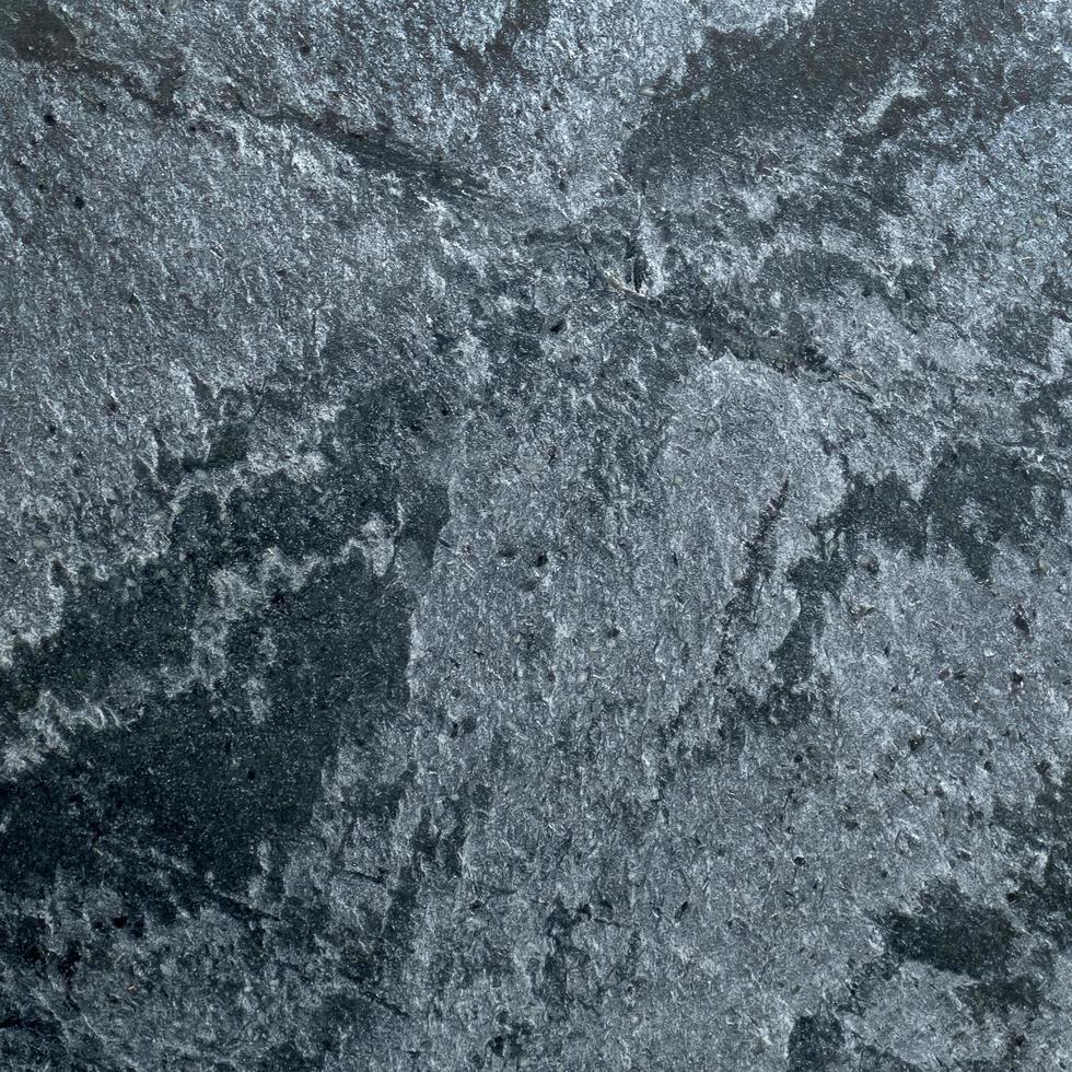 Textura de piedra de granito gris oscuro. foto