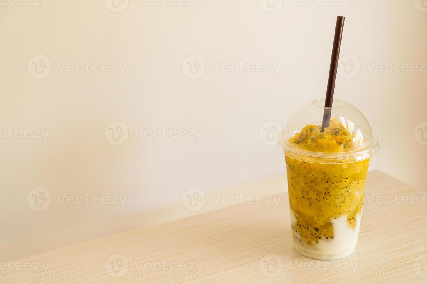 Fresh passion fruit smoothies with yogurt in glass photo