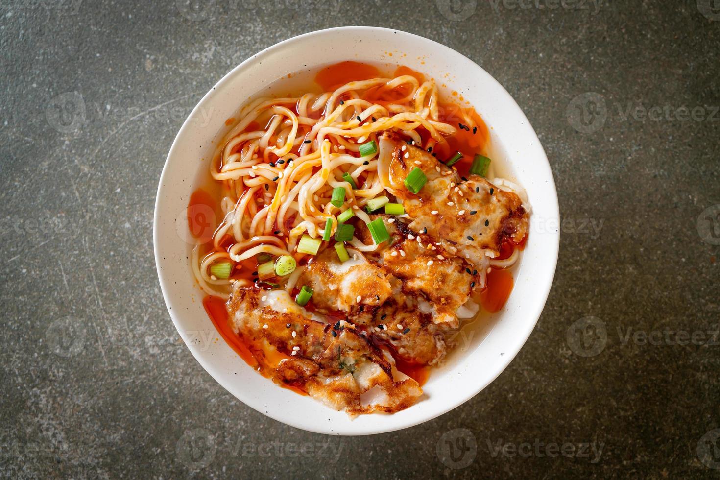 Ramen noodles with gyoza or pork dumplings - Asian food style photo