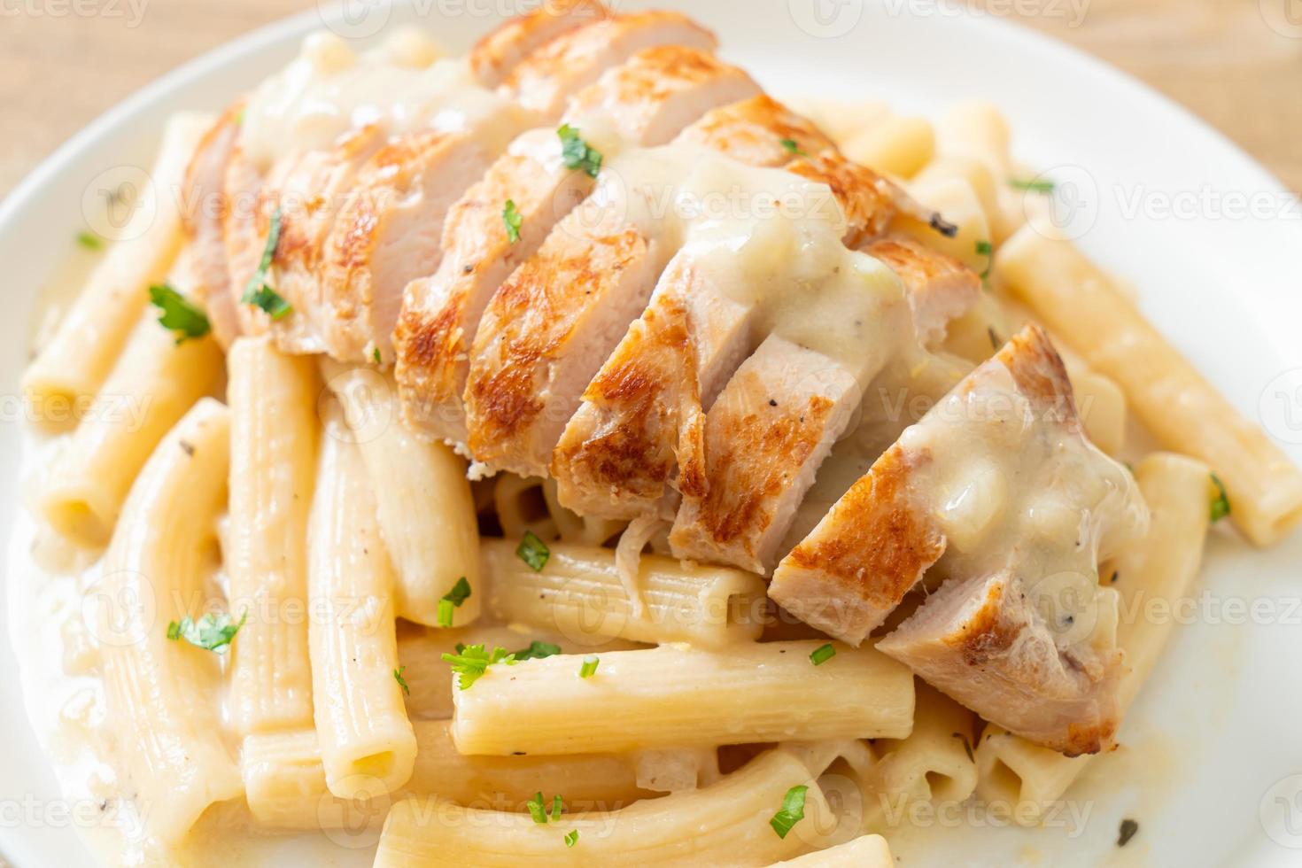 Homemade quadrotto penne pasta white creamy sauce with grilled chicken photo